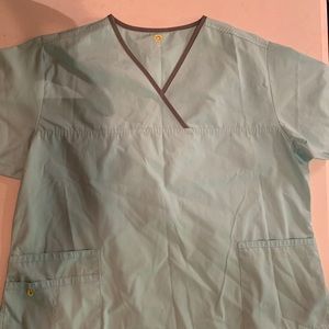 Wonder wink scrub top light blueish in color